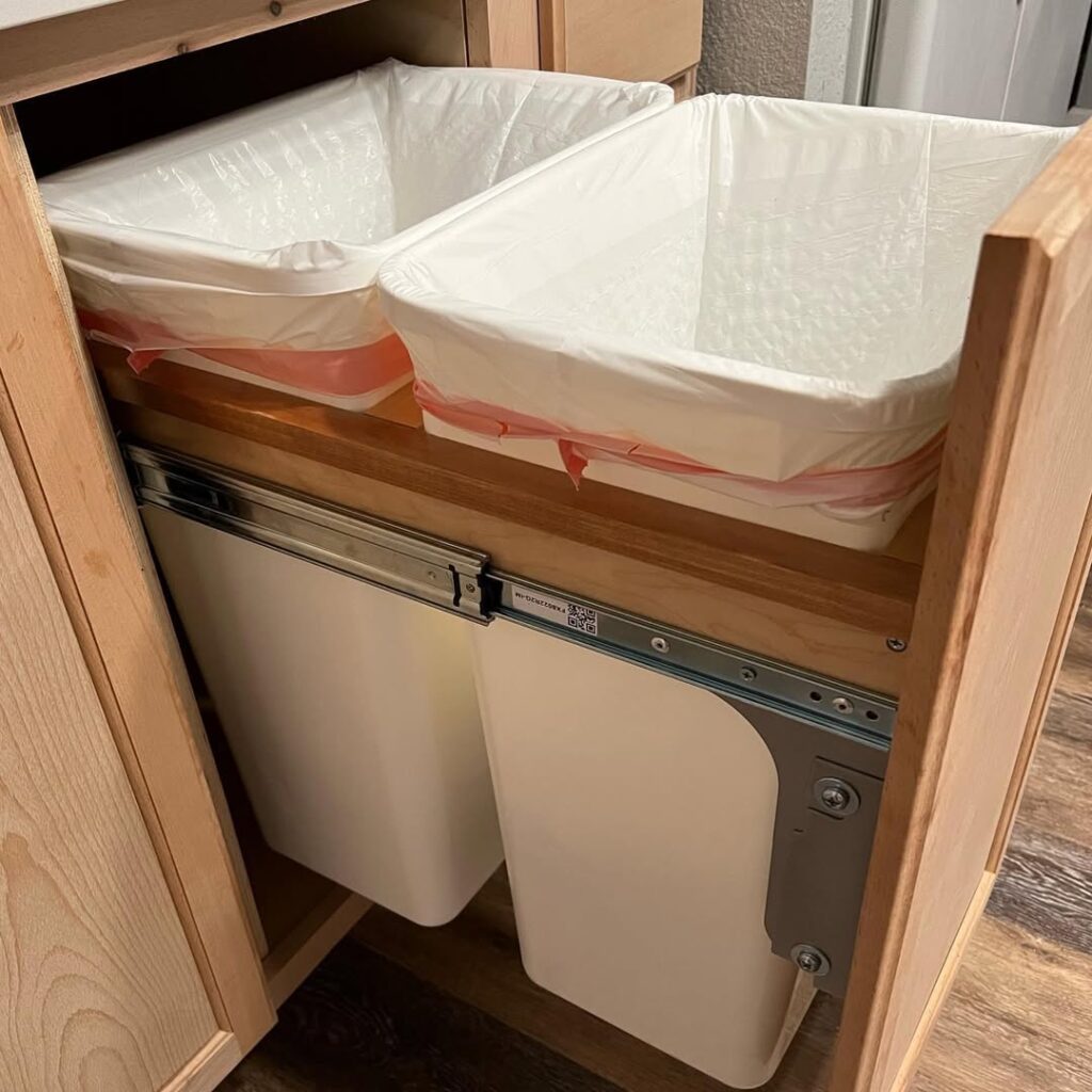 Install Pull-Out Trash Bins for Easy Waste Management